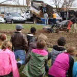 Fifth graders look on with curiosity as Daniel’s Garden Center tills our ground for a huge expansion of the Salford Hills fruit & vegetable garden.