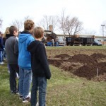 Salford Hills Elementary Students watch as topsoil is mixed in with the freshly tilled ground to provide a welcoming bed for our new 50x50ft. vegetable patch.