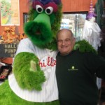 Daniel's Lawn and Garden Owner Stu Strauss with the Phillie Phanatic at the Warm Hugs for for Vets event.